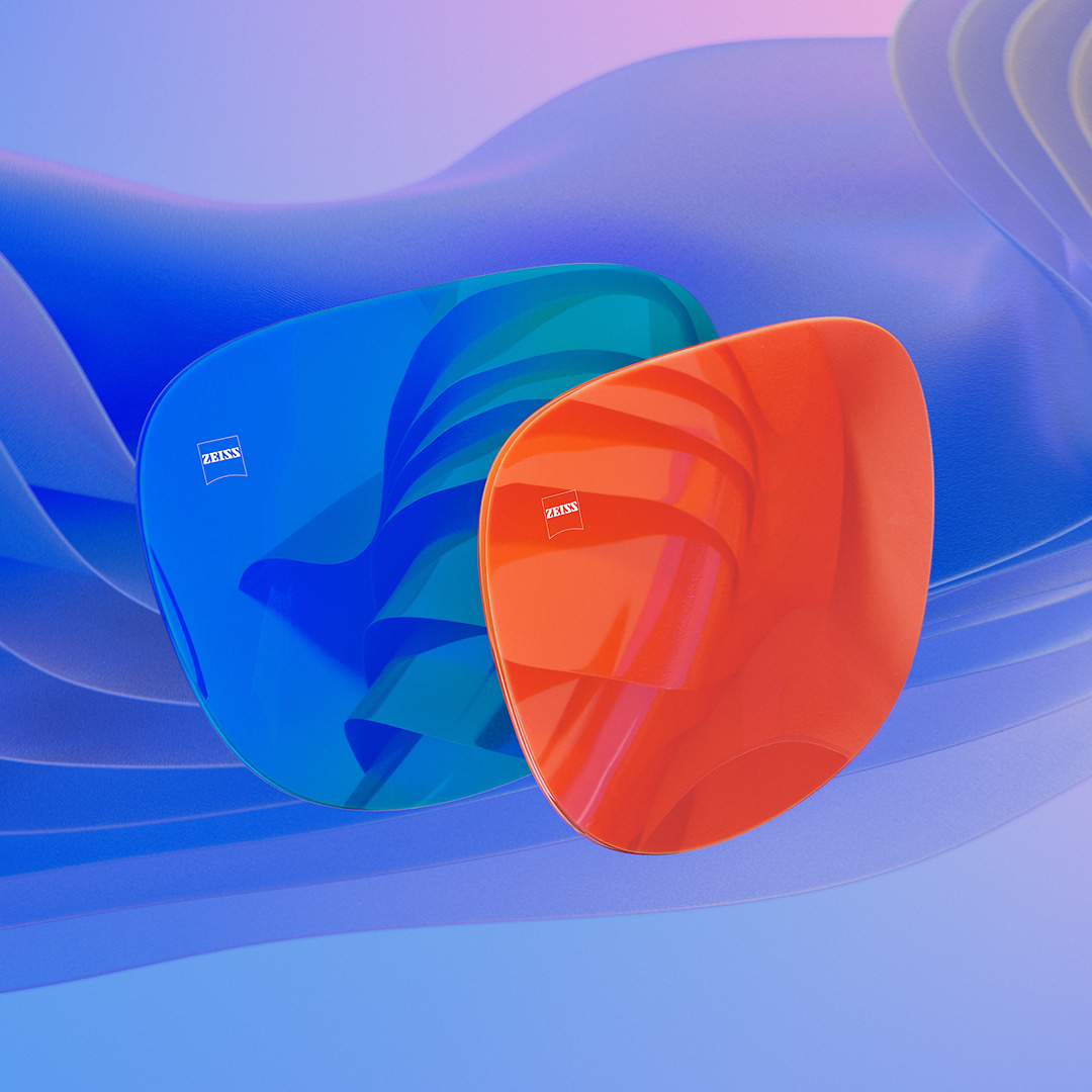 En CGI-illustrasjon i 3D av to solbrilleglass med blå og oransje speilbelegg.