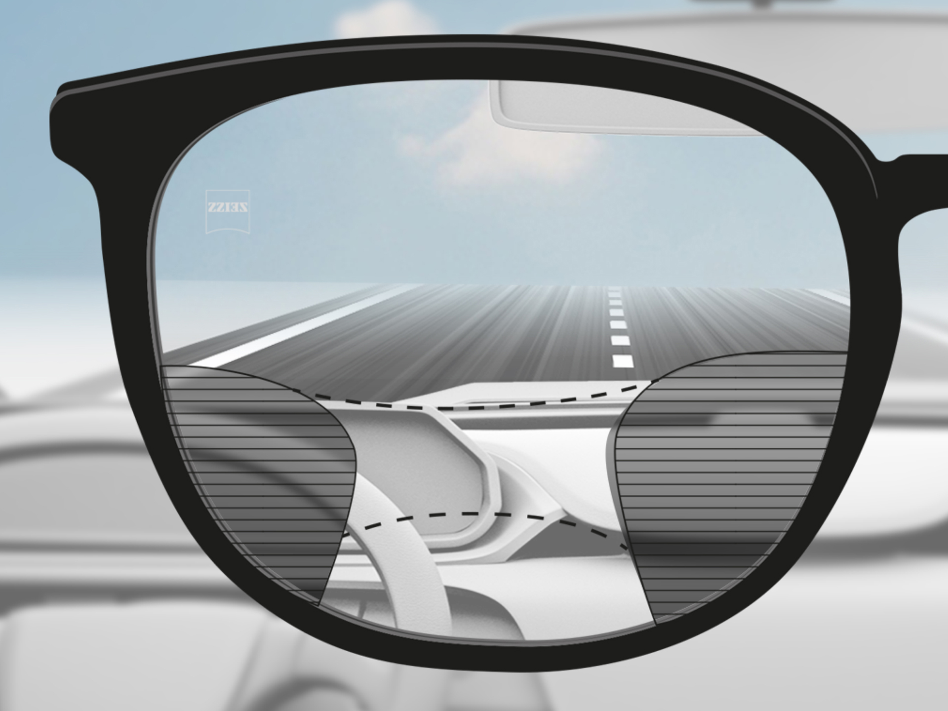 Et perspektivbilde gjennom et ZEISS progressivt DriveSafe-glass: Synssonene er tilpasset slik at føreren har klare synssoner på veien og dashbordet.