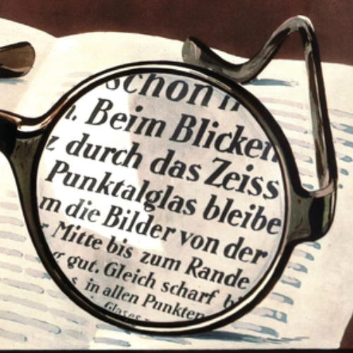 Et bilde av en gammel reklame for ZEISS Punktal-glass som viser klart syn gjennom hele glasset. Dette var revolusjonerende i 1912. 